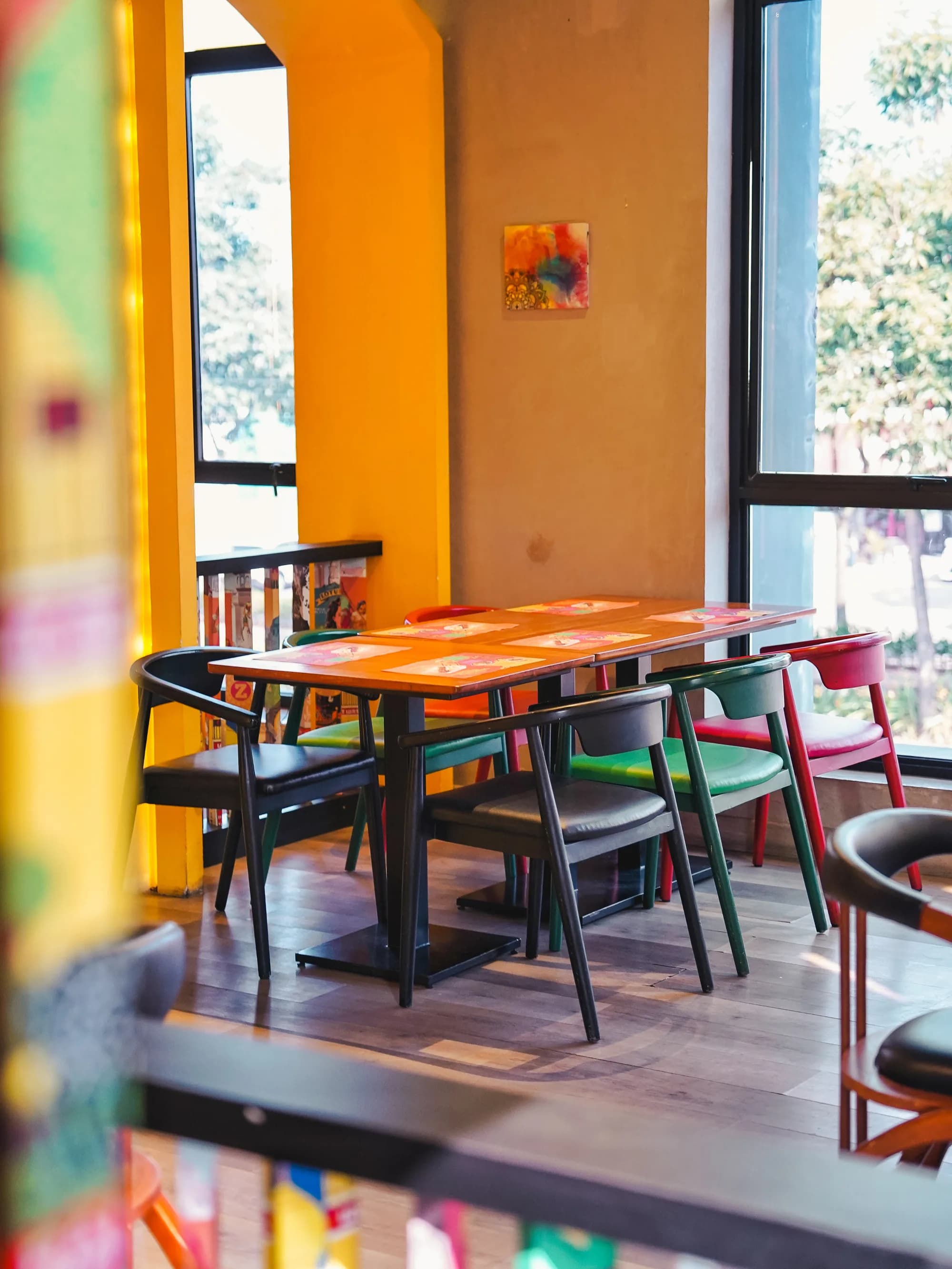Window-side tables at Zibaa Gading Serpong