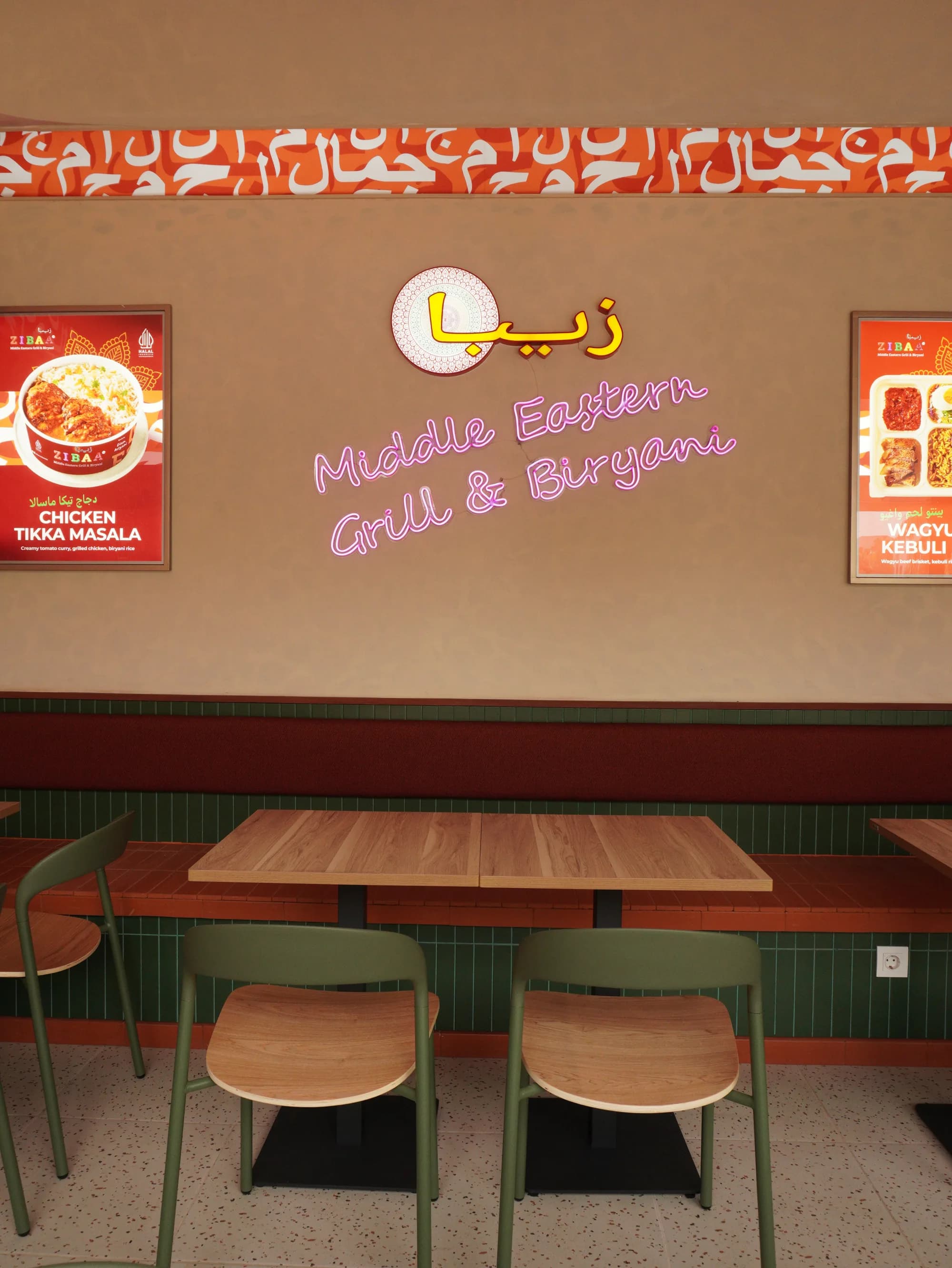 Zibaa neon sign above booth seating at Kamaja Mayestik
