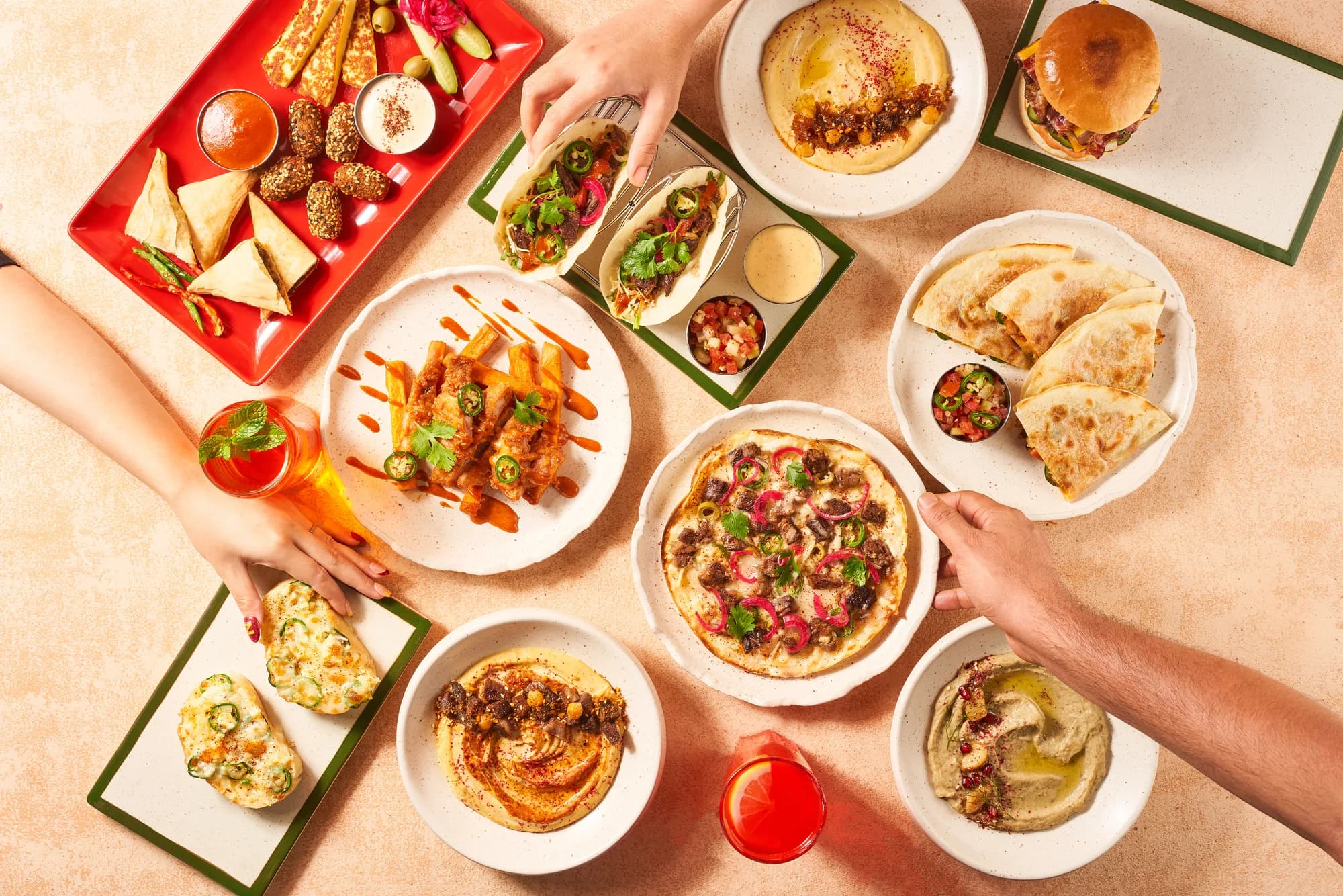 Friends sharing a Middle Eastern feast at Zibaa